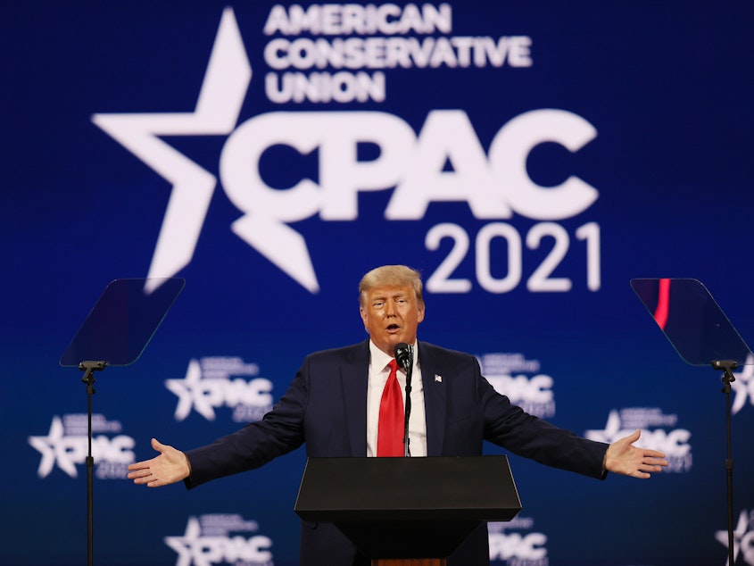 caption: Former President Donald Trump addresses the Conservative Political Action Conference on Sunday in Orlando, Fla.