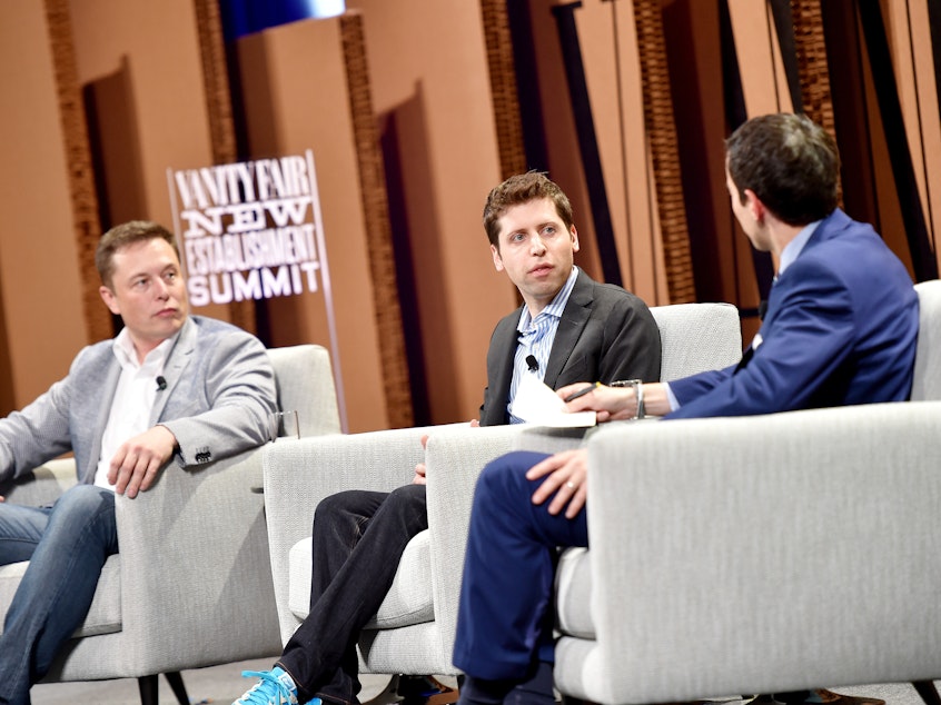 caption: From left, Elon Musk, Sam Altman and Andrew Ross Sorkin, <em>New York Times</em> financial columnist, speak during the Vanity Fair New Establishment Summit at Yerba Buena Center for the Arts on Oct. 6, 2015, in San Francisco.