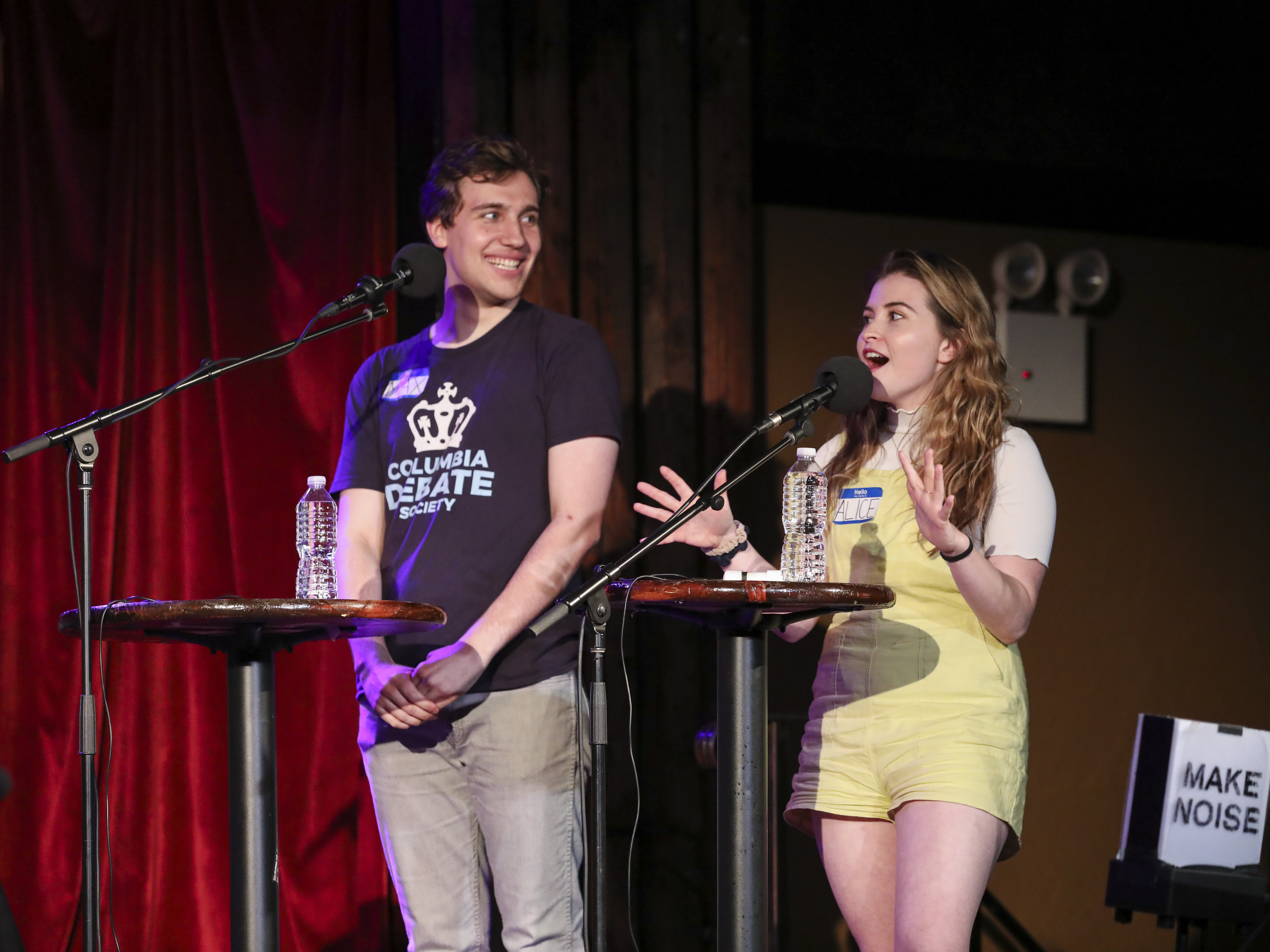 caption: Contestants Max Neuman and Alice Kors appear on<em> Ask Me Another</em> at the Bell House in Brooklyn, New York.