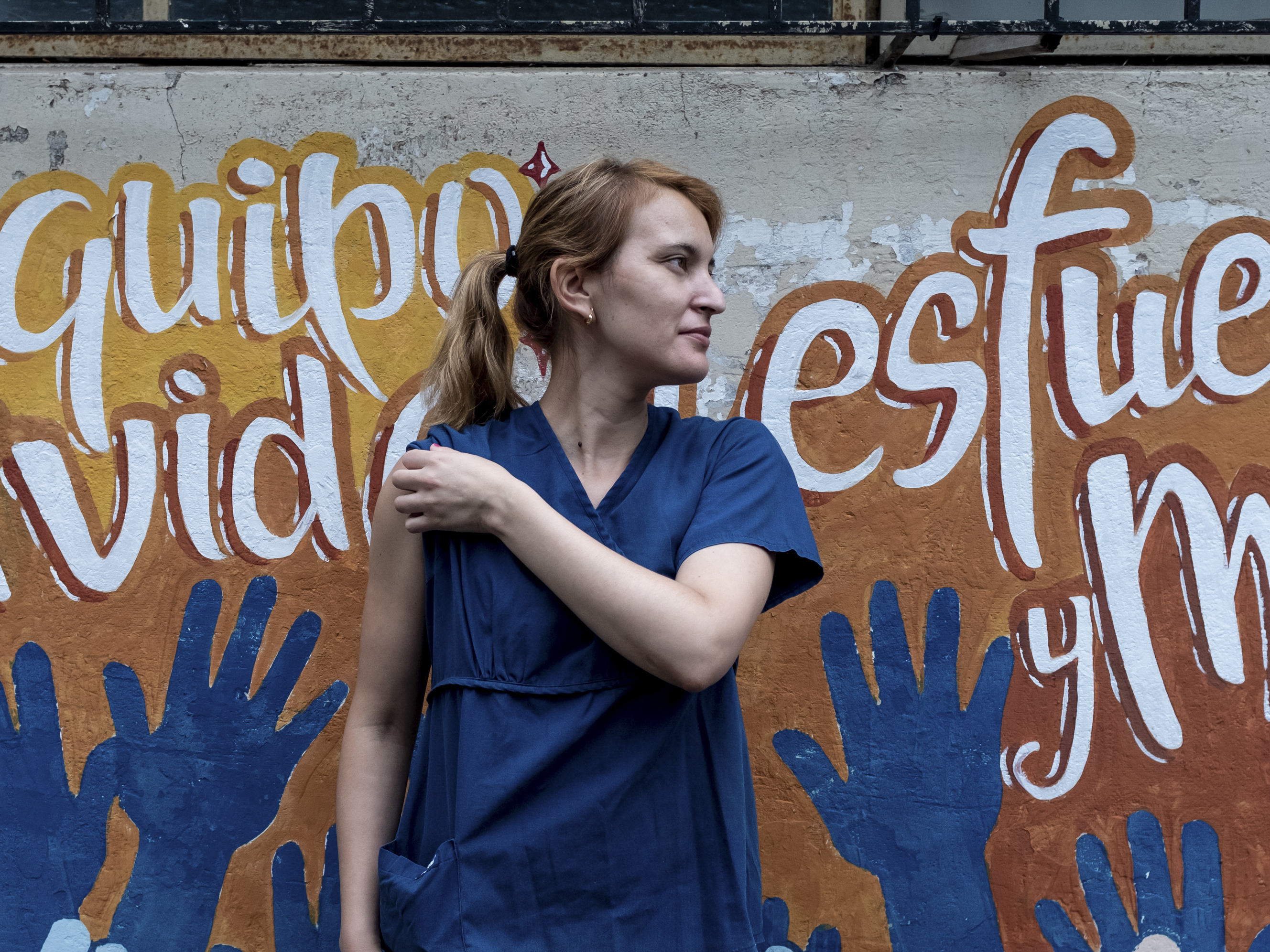 caption: Maria Laura Niz, from the San Martin Hospital, in La Plata, Argentina, was nervous about getting vaccinated. But she's more worried that without the vaccine the pandemic could get worse.