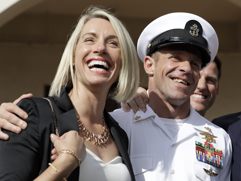 caption: Special Operations Chief Edward Gallagher and his wife, Andrea Gallagher, after the Navy SEAL was acquitted of murder by a military court in San Diego on July 2.