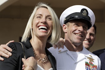 caption: Special Operations Chief Edward Gallagher and his wife, Andrea Gallagher, after the Navy SEAL was acquitted of murder by a military court in San Diego on July 2.