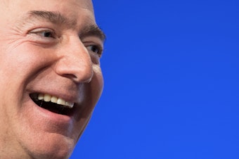 caption: Amazon founder Jeff Bezos is the world's wealthiest person, according to the latest Bloomberg Billionaires Index, with a net worth of $186 billion. Four others also have fortunes over $100 billion. Here, Bezos speaks at a conference in 2018.