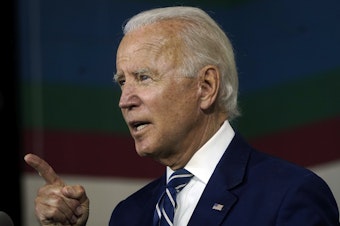 caption: Joe Biden speaks about economic recovery during a campaign event at Colonial Early Education Program at the Colwyck Center in July. In an interview with Stephen Colbert, the president-elect defended his son Hunter, whose tax affairs are under investigation.