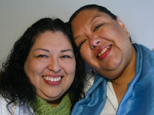caption: Candy and Estela Reyes shared memories of their father during a 2012 StoryCorps interview in El Paso, Texas.