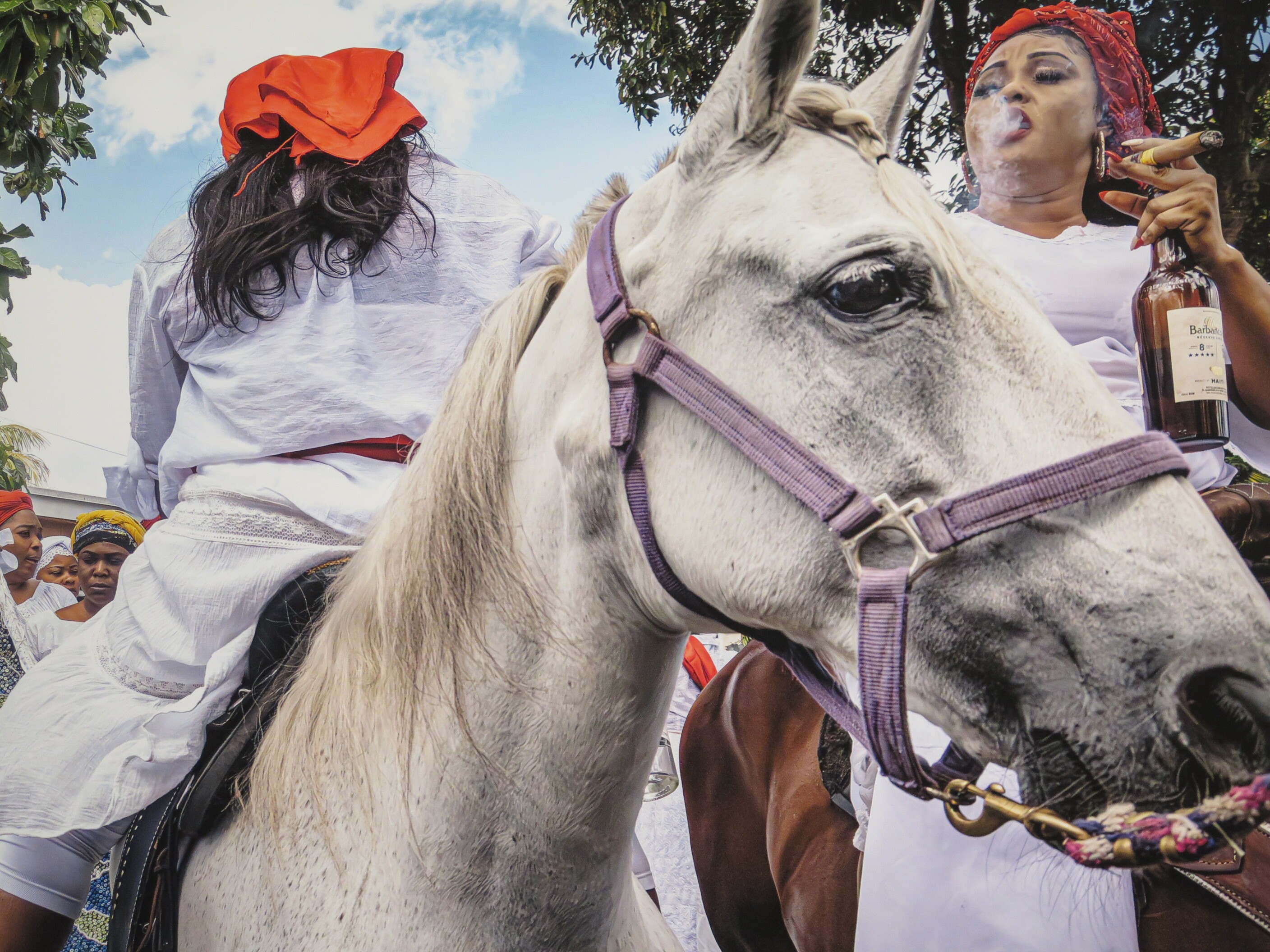 caption: Photographer Woosler Delisfort documents ceremonies from vodou, ifa and santeria traditions actively practiced today