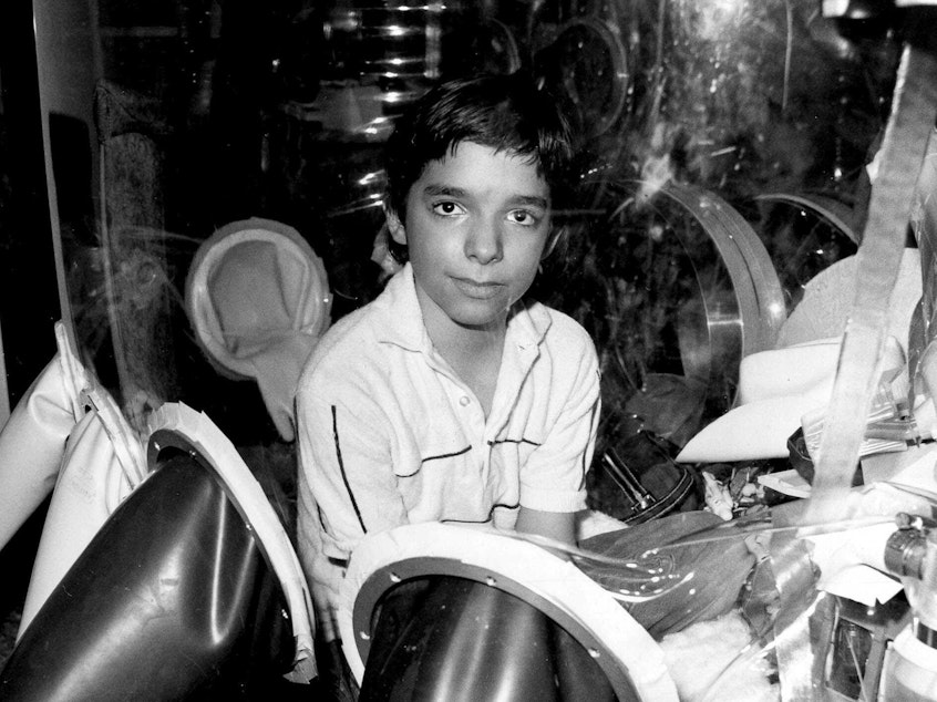 caption: David Vetter, pictured in September 1982 inside part of the bubble environment that was his protective home until he died in 1984. Today most kids born with SCID are successfully treated with bone marrow transplants, but researchers think gene therapy is the future.