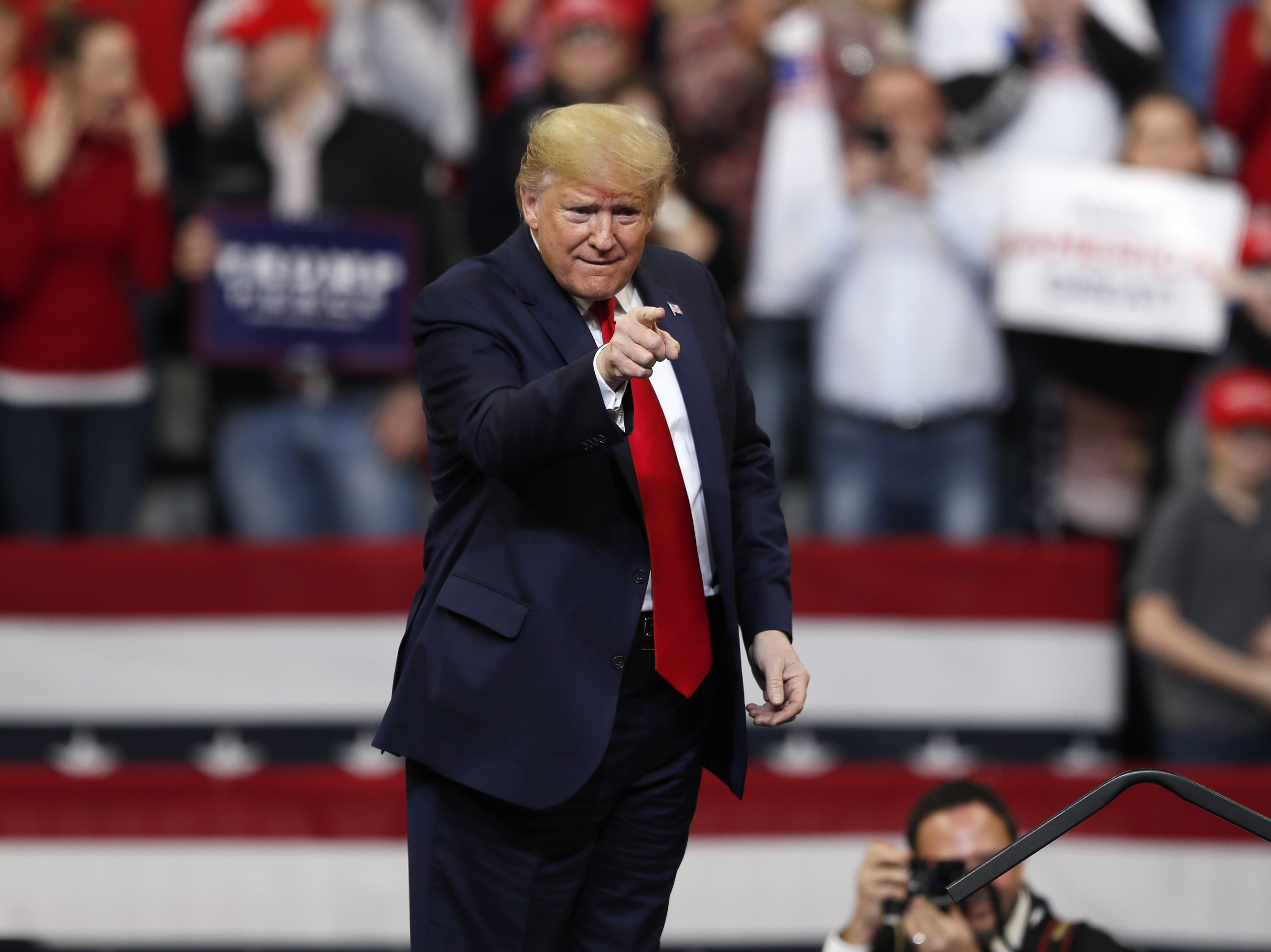 caption: President Trump arrives at a campaign rally at Drake University in Des Moines, Iowa, last week.