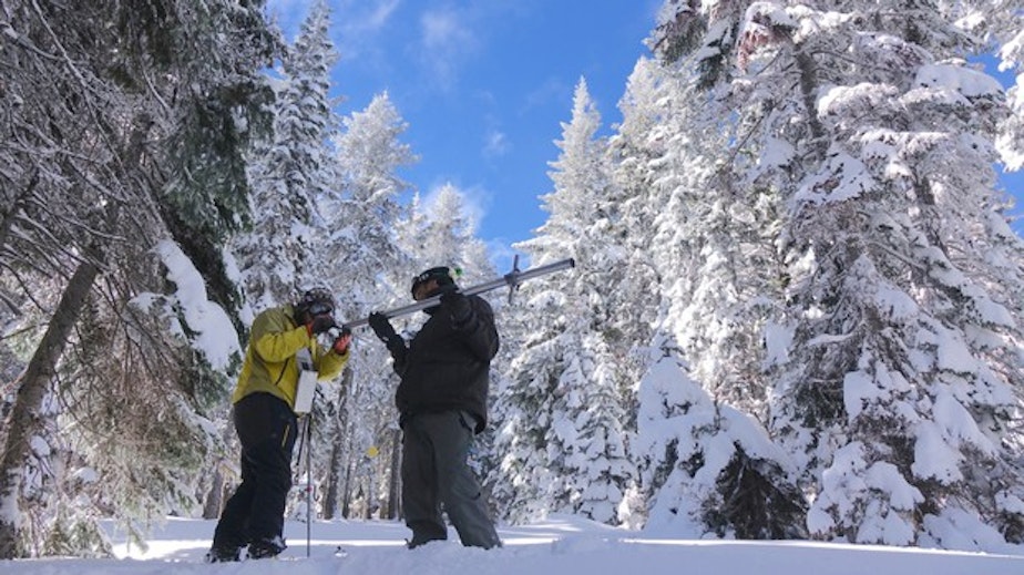 caption: <p>Ben Thorpe (left) and Shavon Haynes measure the snowpack on Mount Ashland.</p>