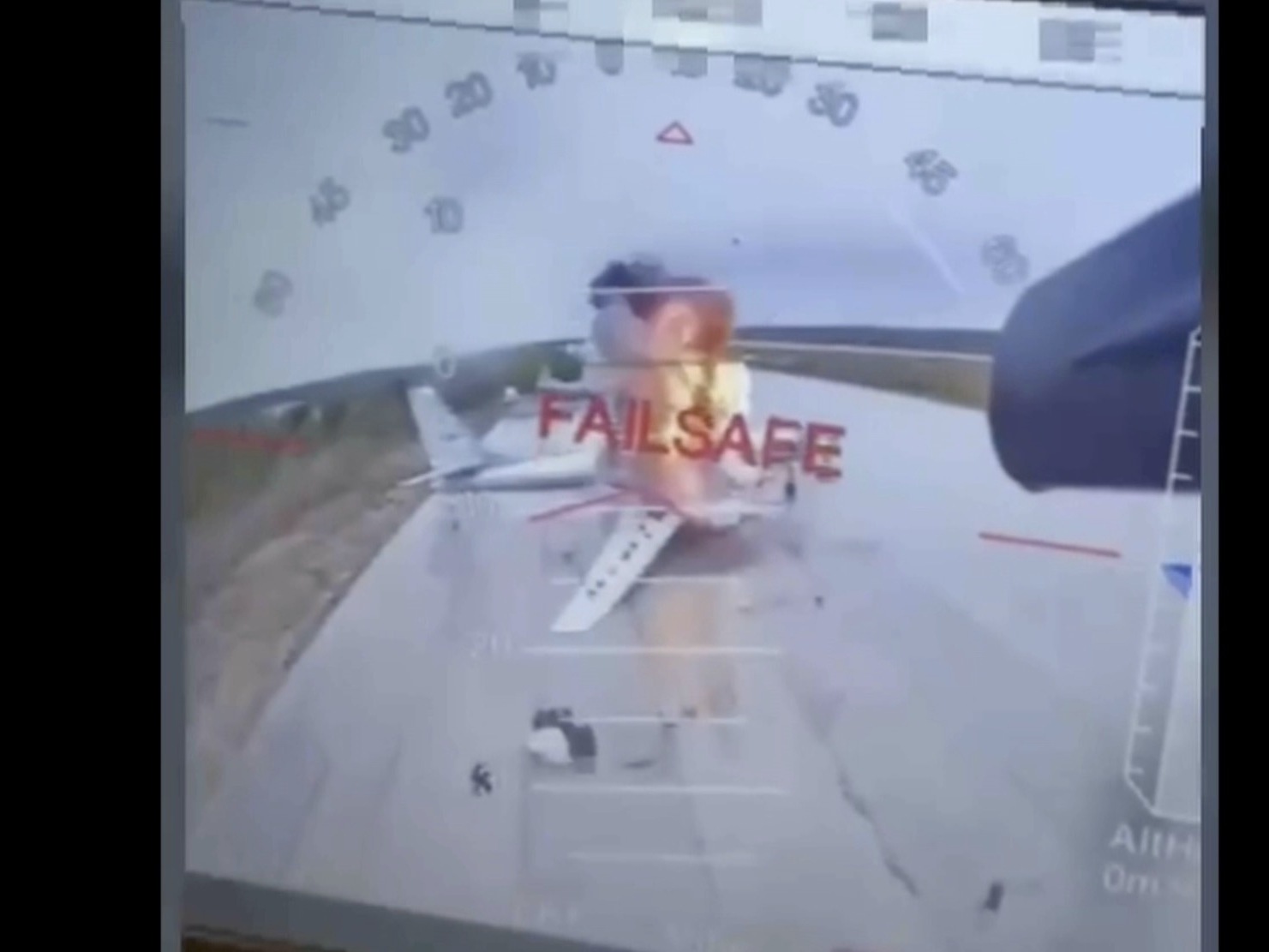 caption: In this image taken from video released June 1, 2025, by a source in the Ukrainian Security Service shows a Ukrainian drone striking Russian planes deep in Russia's territory.