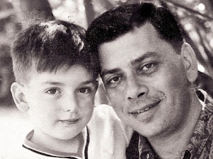 caption: A 5-year-old Jeffrey Sherman is pictured with his father, songwriter Robert Sherman, in the early 1960s.