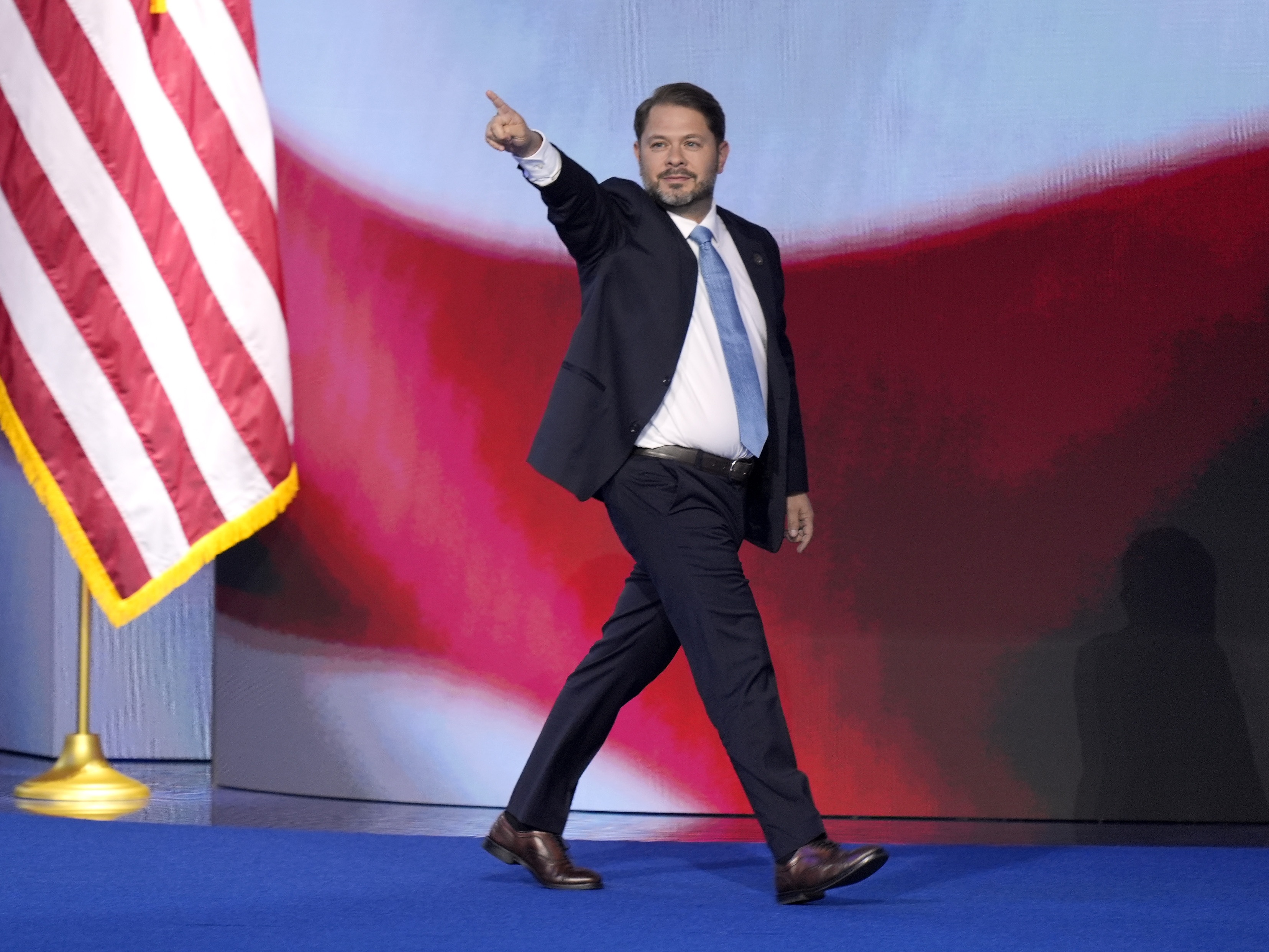 caption: Rep. Ruben Gallego, D-Ariz., walks on stage to speak during the Democratic National Convention Thursday, Aug. 22, 2024, in Chicago.