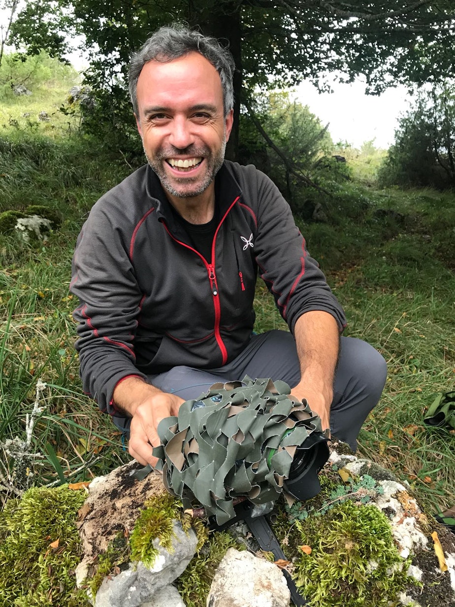 caption: Bruno D'Amicis sets up a wildlife camera in Abruzzo National Park in Italy in hopes of getting a picture of a brown bear.
