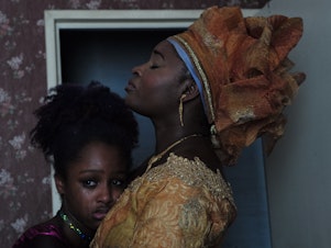 caption: Amy (left), played by Fathia Youssouf, and her mother Mariam, played by Maïmouna Gueye, in a still from the film, <em>Cuties</em>.