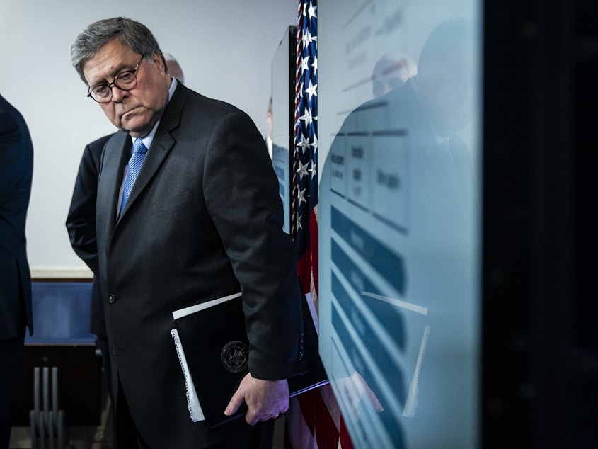 caption: U.S. Attorney General William Barr listens during a White House briefing.