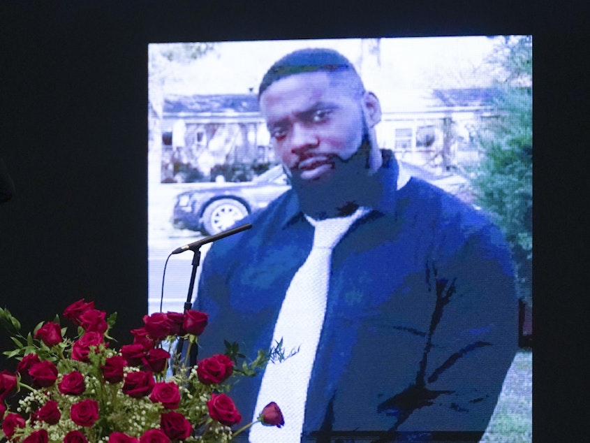 caption: An image of Andrew Brown Jr. at a memorial on Saturday.