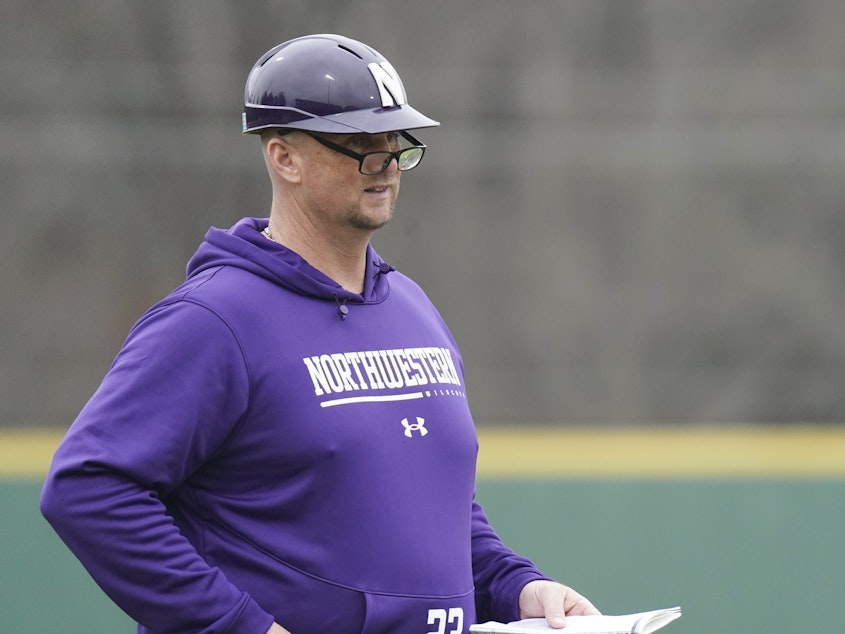 caption: Northwestern head coach Jim Foster looks on from the third base box during an NCAA baseball game against USC Upstate on Sunday, Feb. 26, 2023, in Spartanburg, S.C.
