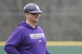 caption: Northwestern head coach Jim Foster looks on from the third base box during an NCAA baseball game against USC Upstate on Sunday, Feb. 26, 2023, in Spartanburg, S.C.