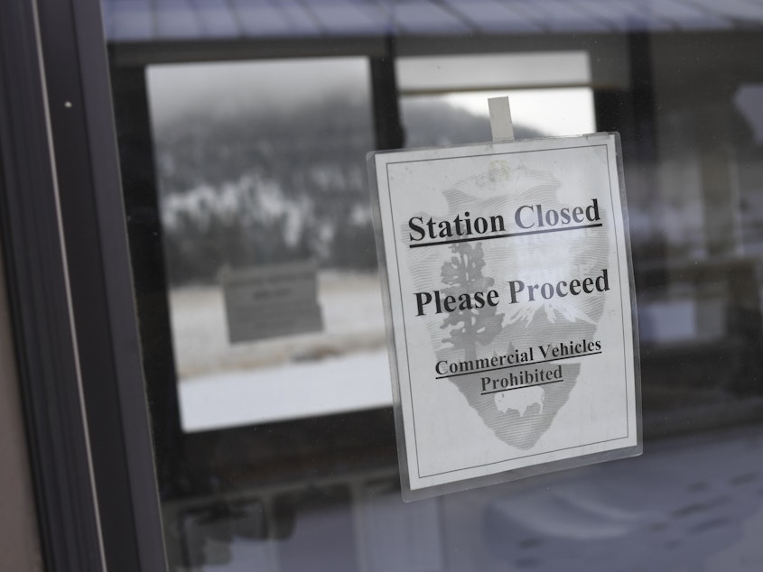 caption: A pay station at Rocky Mountain National Park is closed on Thursday in Estes Park, Colo. Many parks remain open but unstaffed during the partial shutdown of the federal government.