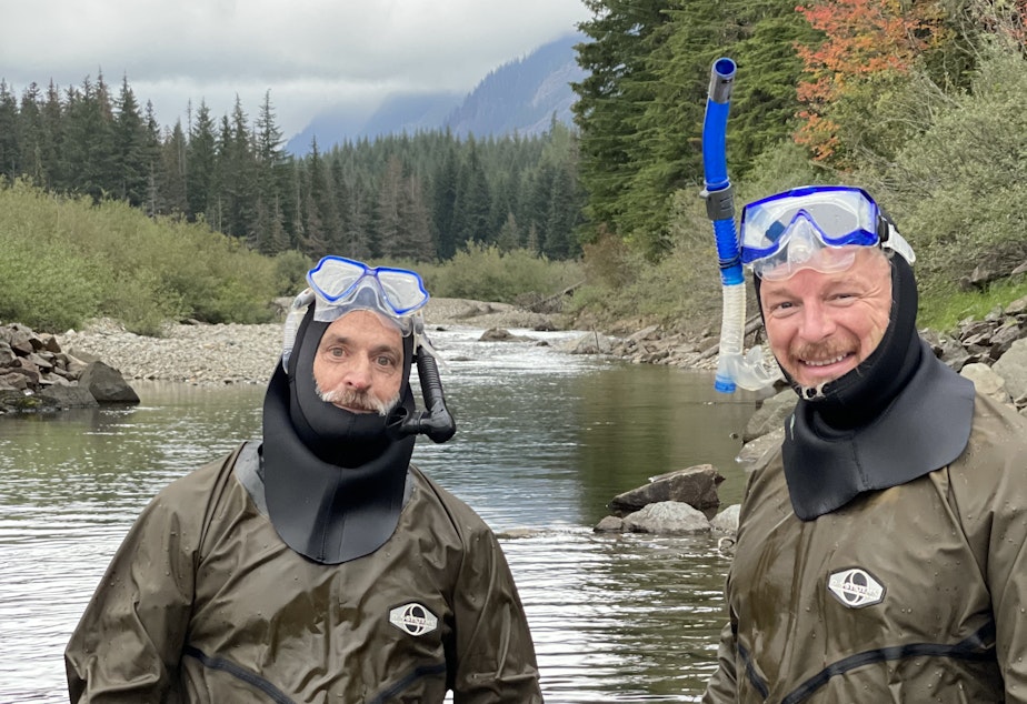 caption: Dr. Paul James (left) stands with Chris Morgan (right) after completing a snorkel survey in Gold Creek. 