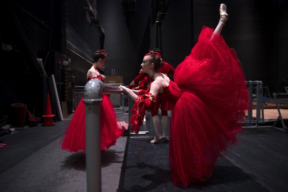 caption: Pacific Northwest Ballet student Elaine Rand warms up backstage before the second act of Cinderella on Saturday, February 1, 2020, at McCaw Hall in Seattle.