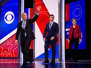 caption: (From left) Former New York City Mayor Mike Bloomberg, former South Bend, Ind., Mayor Pete Buttigieg and Massachusetts Sen. Elizabeth Warren take the stage before the Democratic debate.