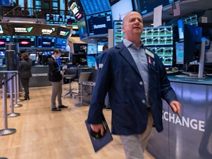 caption: Traders on the floor of the New York Stock Exchange in New York City on May 16, 2024, when the Dow hit 40,000 points for the first time ever.