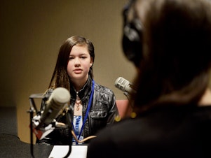 caption: Fifth grader Nina Perry at KUOW Public Radio in Seattle