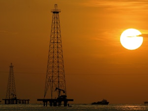 caption: Oil drills in Maracaibo Lake in Venezuela's oil rich Zulia state. The U.S. is renewing sanctions on Venezuela's oil industry.