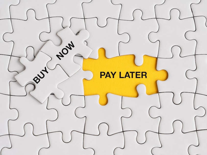 caption: The Consumer Financial Protection Bureau is requiring buy-now, pay-later lenders to provide the same protections to shoppers as credit card companies do.