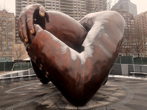 caption: The Embrace, the new memorial sculpture in Boston made in tribute to Martin Luther King Jr. and Coretta Scott King, was unveiled on Friday.