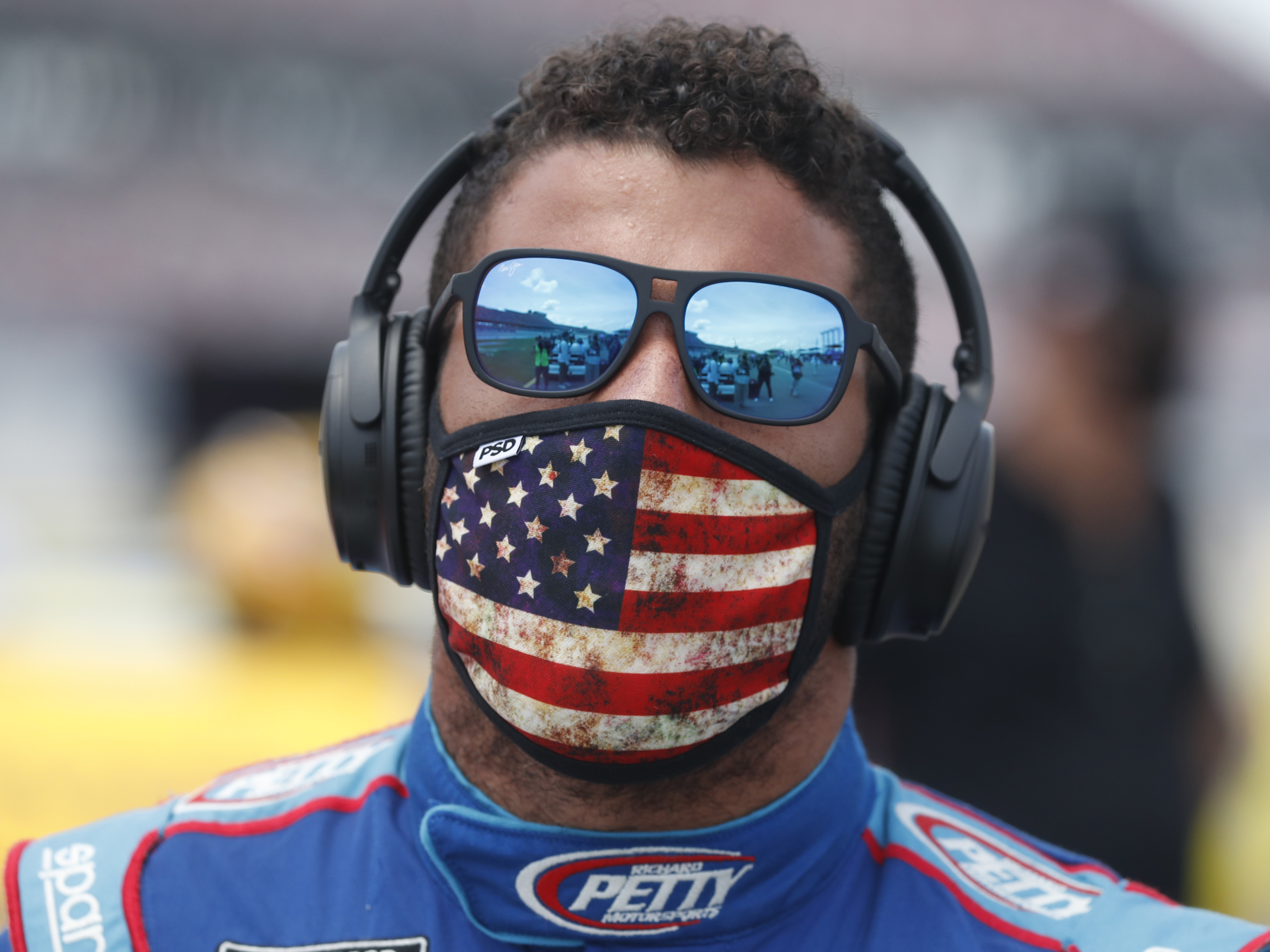 caption: The FBI team investigating the incident concluded the "noose" found in Bubba Wallace's garage was actually a pull rope that had been in the stall long before the driver was assigned.