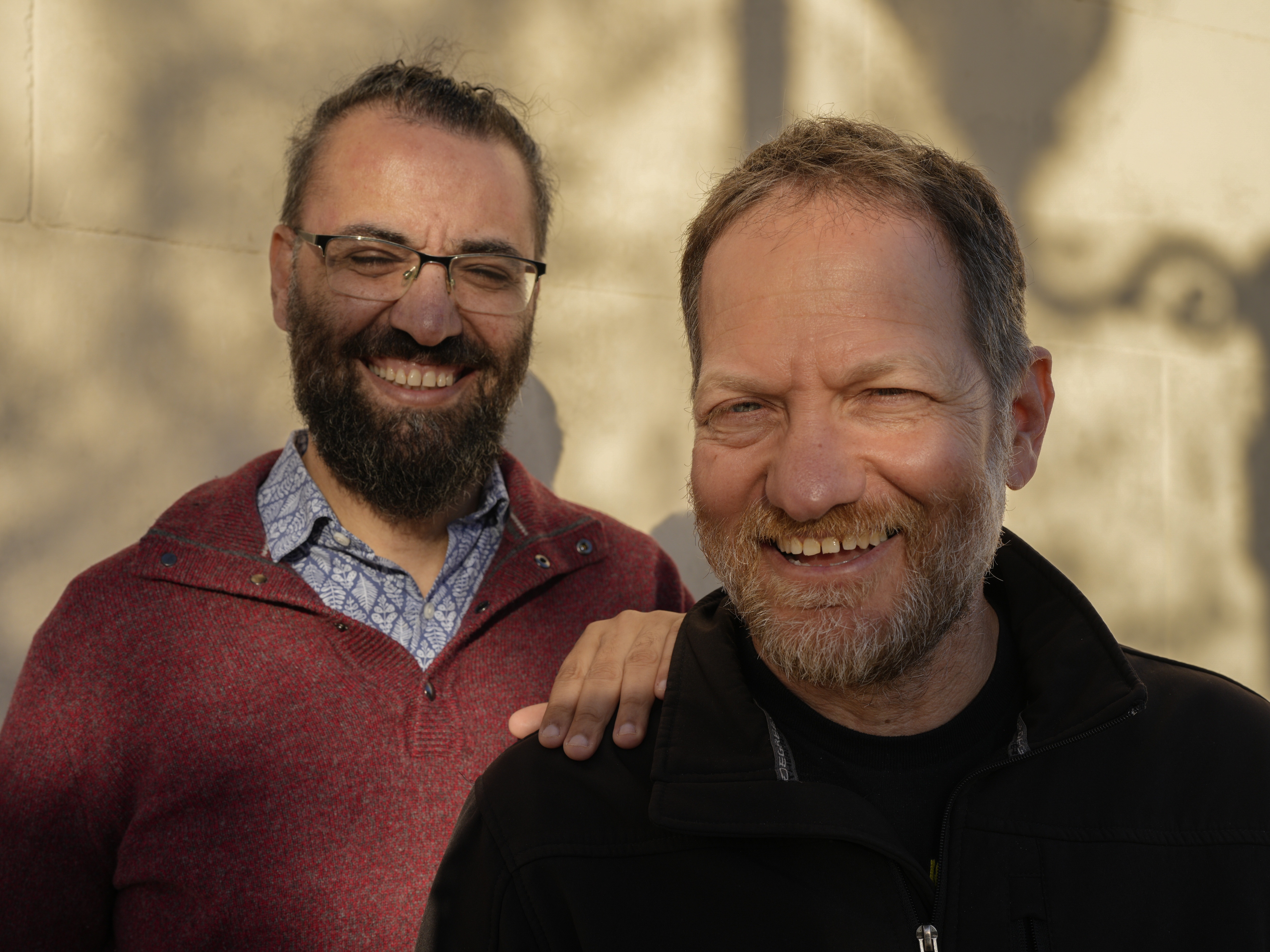 caption: Aziz Abu Sarah (left) and Maoz Inon in Jaffa, Israel, in January. Their new book, <em>The Future Is Peace: A Shared Journey Across the Holy Land</em>, documents their peace activism that emerged from trauma and loss. Abu Sarah's brother died from injuries inflicted in Israeli custody and Inon's parents were killed by Hamas-led militants on Oct. 7, 2023.