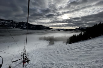 caption: The Summit at Snoqualmie ski resort as seen from a chair lift.