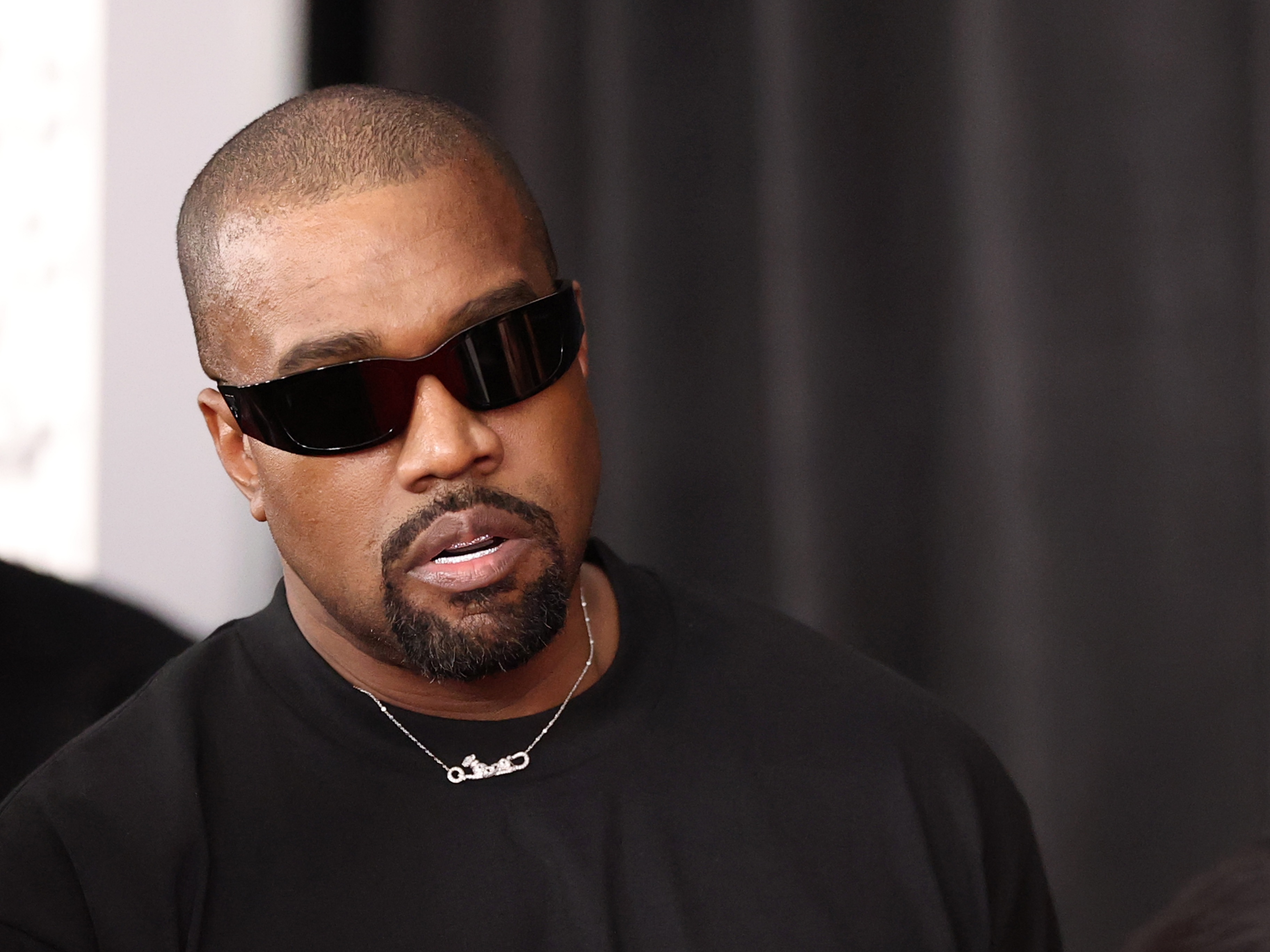 caption: Ye, seen here in Los Angeles in 2025, was barred from entering the U.K. to perform at a festival this summer. The artist, previously known as Kanye West, has been attempting to comeback following a series of antisemitic statements.