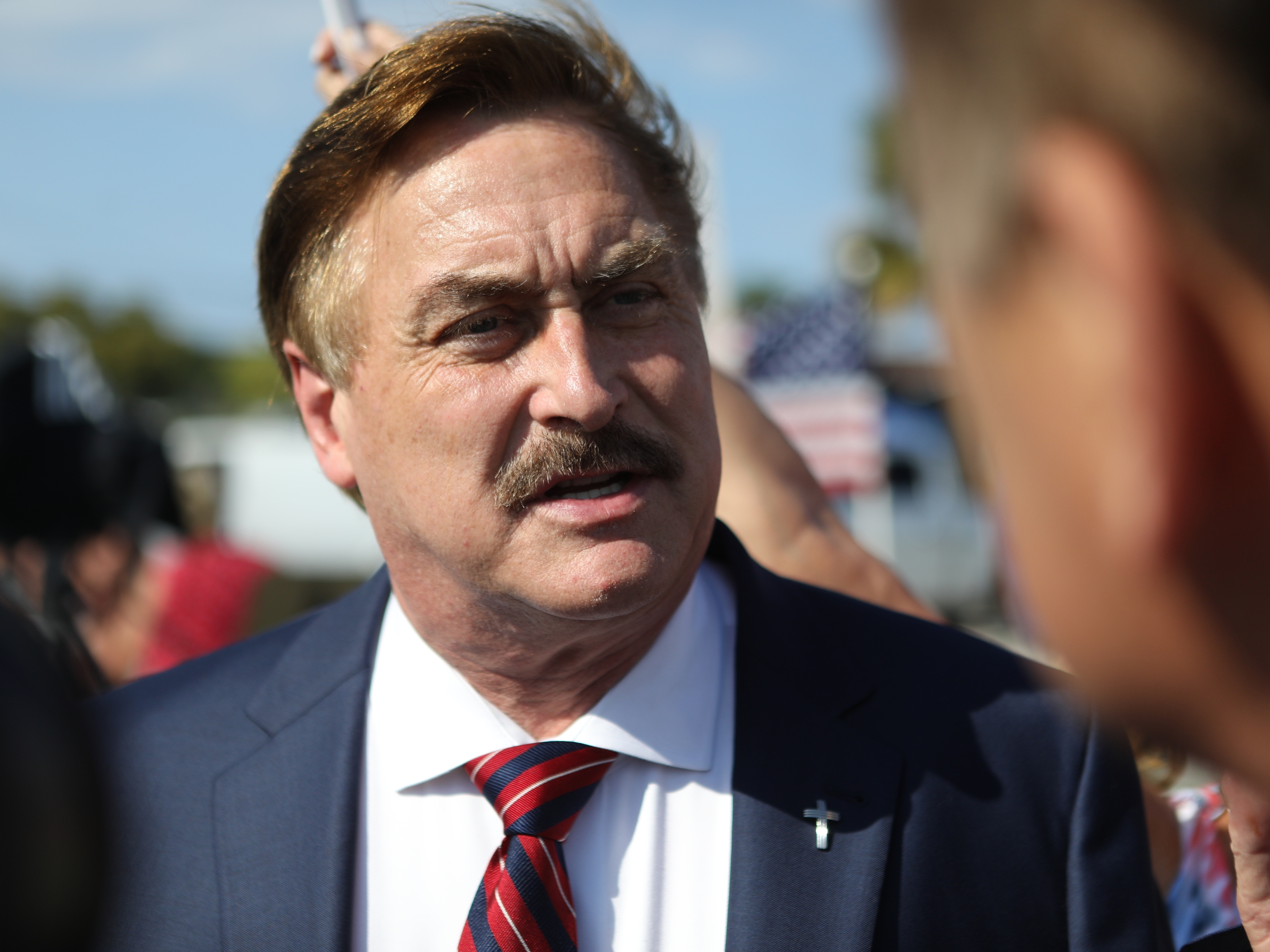 caption: MyPillow CEO Mike Lindell arrives at a gathering of supporters of Donald Trump near Trump's residence in Palm Beach, Fla., on April 4, 2023. On July 7, 2025, Lindell's lawyers were fined thousands of dollars for submitting a legal filing riddled with AI-generated mistakes.