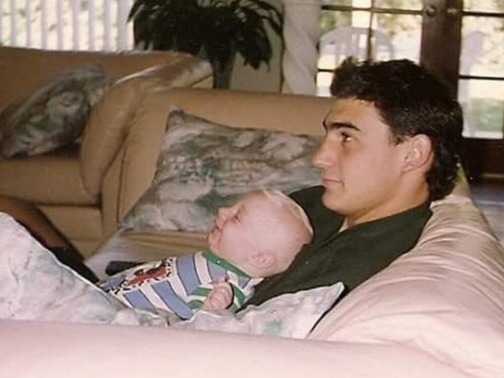 caption: Alek Hermon as a baby with his father, Michael, in 1992.