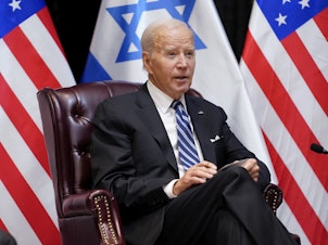 caption: President Joe Biden speaks as he and Israeli Prime Minister Benjamin Netanyahu participate in an expanded bilateral meeting with Israeli and U.S. government officials, Wednesday in Tel Aviv.