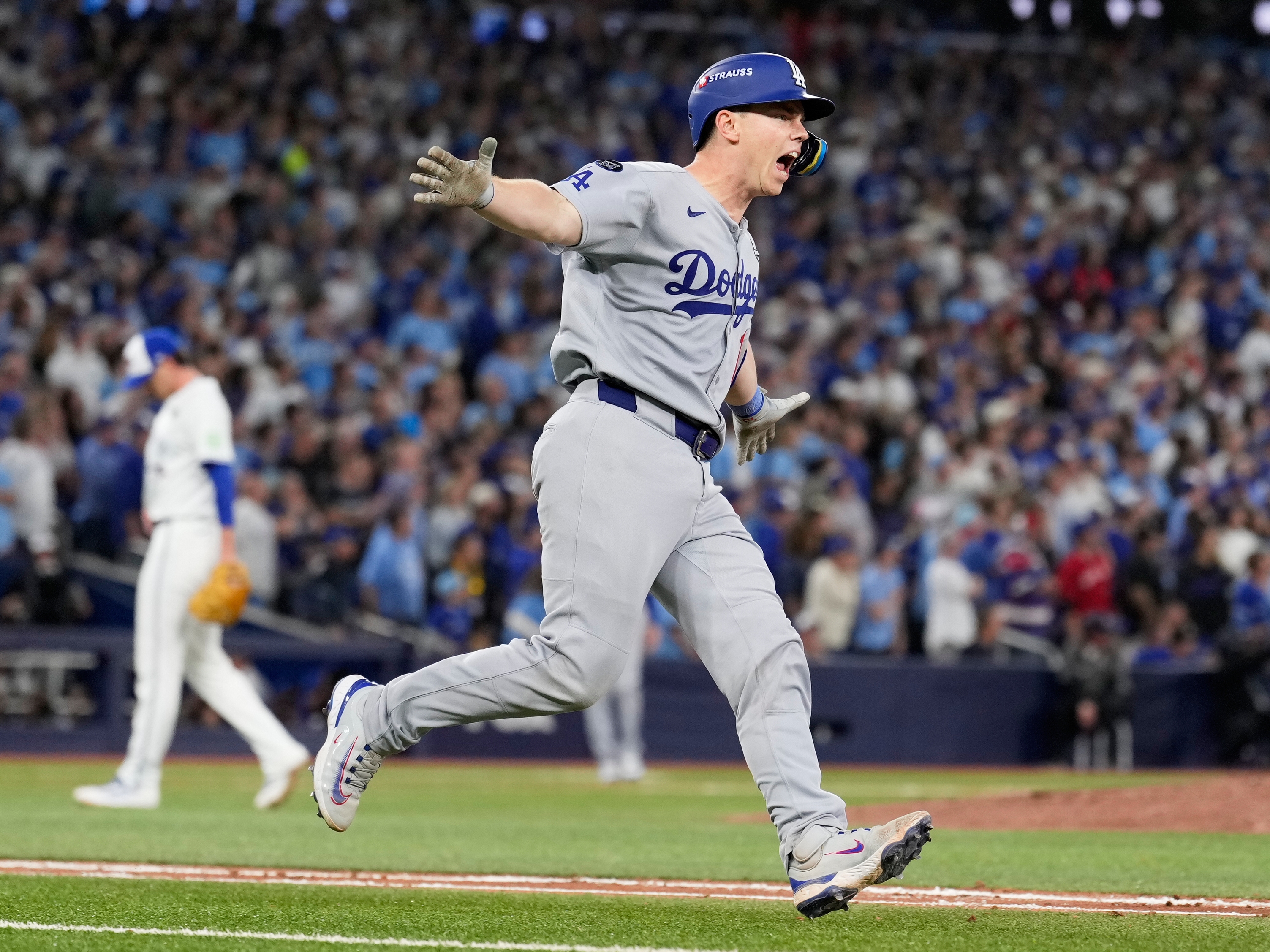 caption: Los Angeles Dodgers' Will Smith celebrates a home run against the Toronto Blue Jays during the11th inning in Game 7 of baseball's World Series, Sunday, Nov. 2, 2025, in Toronto.