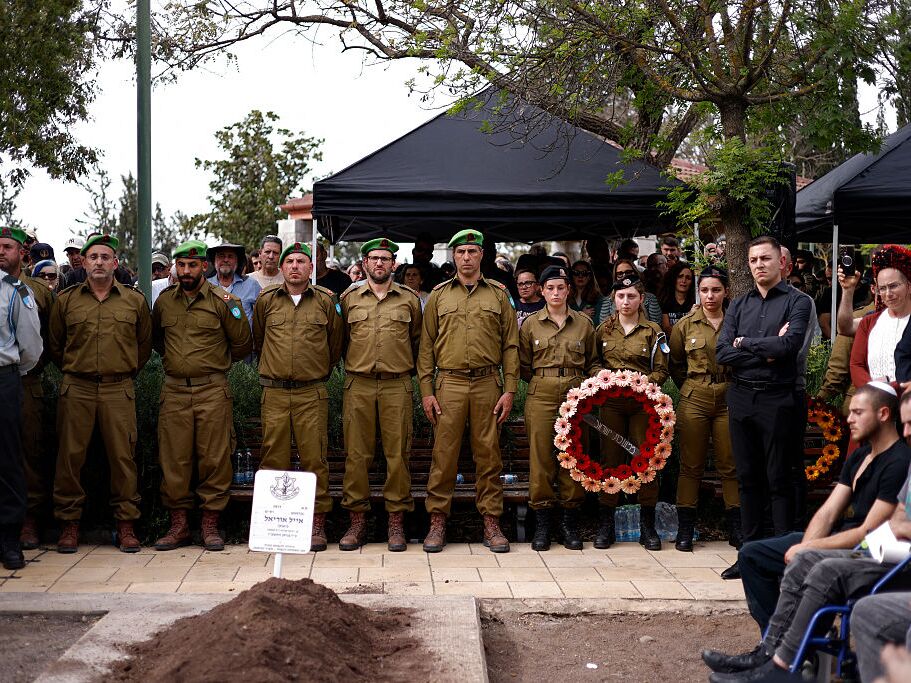 caption: Comrades, relatives and friends of Sgt. Maj. (Res.) Ayal Uriel Bianco, who was reportedly killed in combat in southern Lebanon, attend his funeral in Katzrin in the Israeli-annexed Golan Heights on Tuesday.