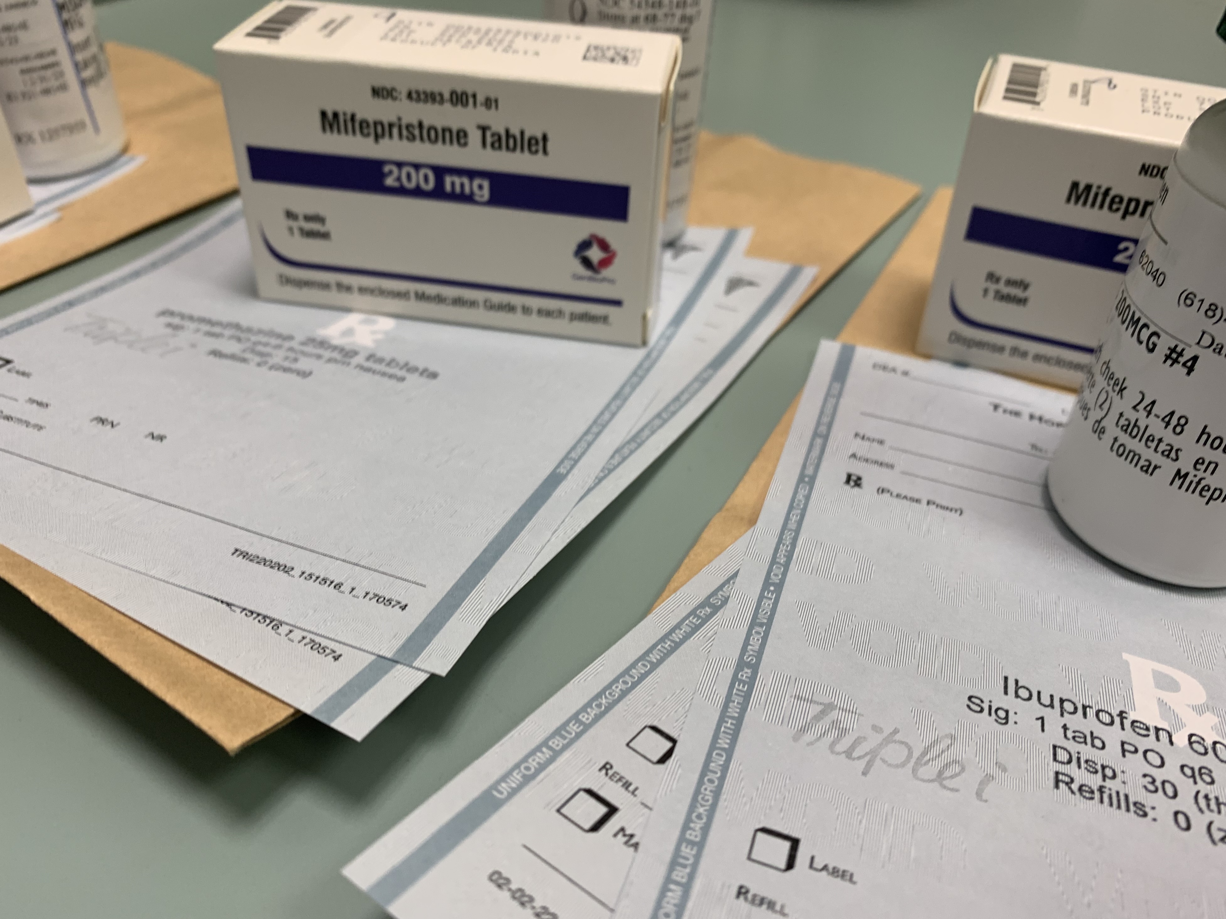 caption: Boxes containing doses of the abortion pill mifepristone are laid out at the Hope Clinic in Illinois. The Comstock Act of 1873, which outlawed the distribution of "obscene" materials such as contraception, is being cited as a basis for blocking the mailing of mifepristone.