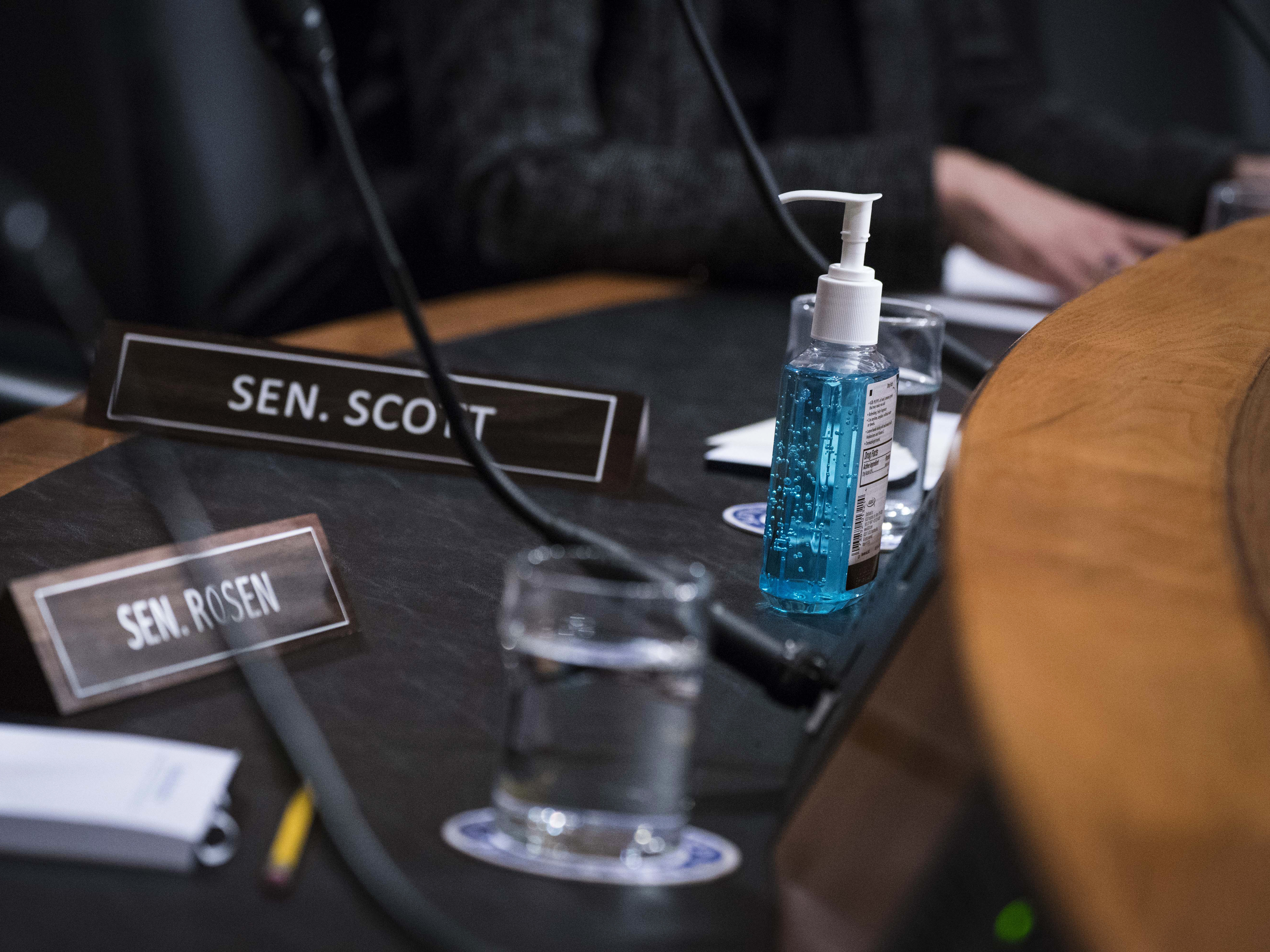 caption: A bottle of hand sanitizer is seen during a Senate Homeland Security Committee hearing on Capitol Hill Thursday. Lawmakers are preparing to what to do if coronavirus hits the Capitol.