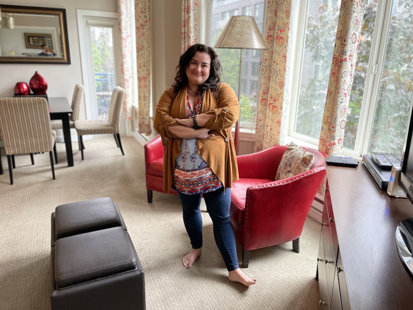 caption: Realtor Kaela Valdes, pictured in a Belltown condo she and her mother rent out as an Airbnb. 