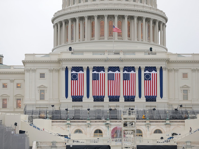 caption: Wednesday's inauguration, coming two weeks to the day after the insurrection on the Capitol, will be unlike any other in living memory, writes NPR's Michel Martin. Above, the Capitol building is seen as workers prepare for the inauguration ceremony for Barack Obama in 2013.