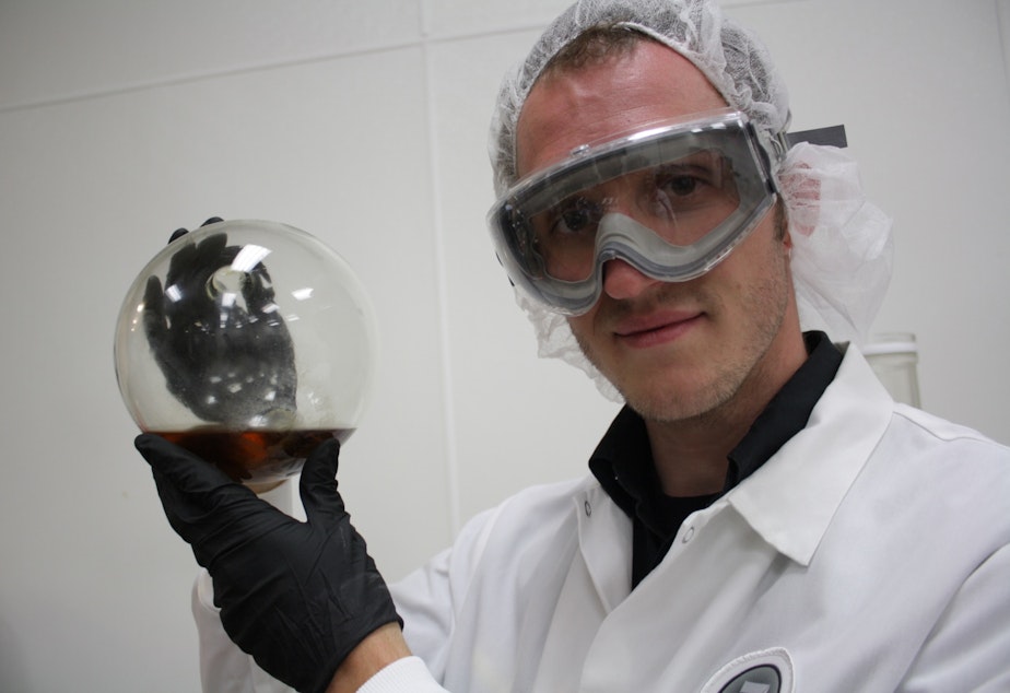 caption: Db3's Chemist Eric Winterstein measures THC content in recreational marijuana. He has two dreams: bringing science to medical marijuana, and someday enjoying a legal drink made from this mixture of alcohol and THC, a byproduct of his lab.