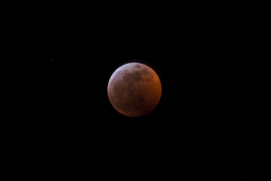 caption: A super blood wolf moon lunar eclipse is shown on Sunday, January 20, 2019, in Seattle.
