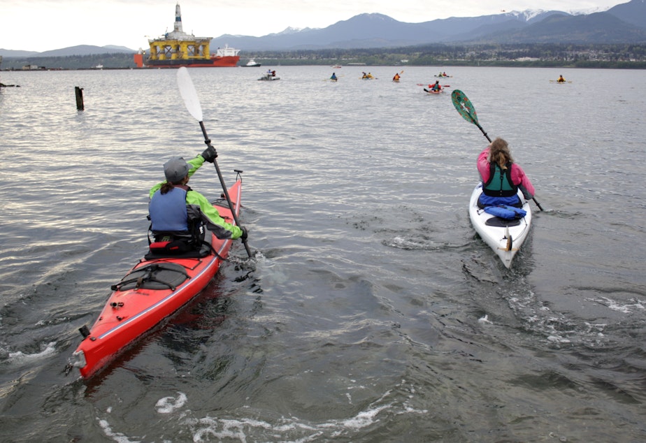 caption: Kayakers protesting the arrival of Shell's Polar Pioneer rig in Port Angeles in April.