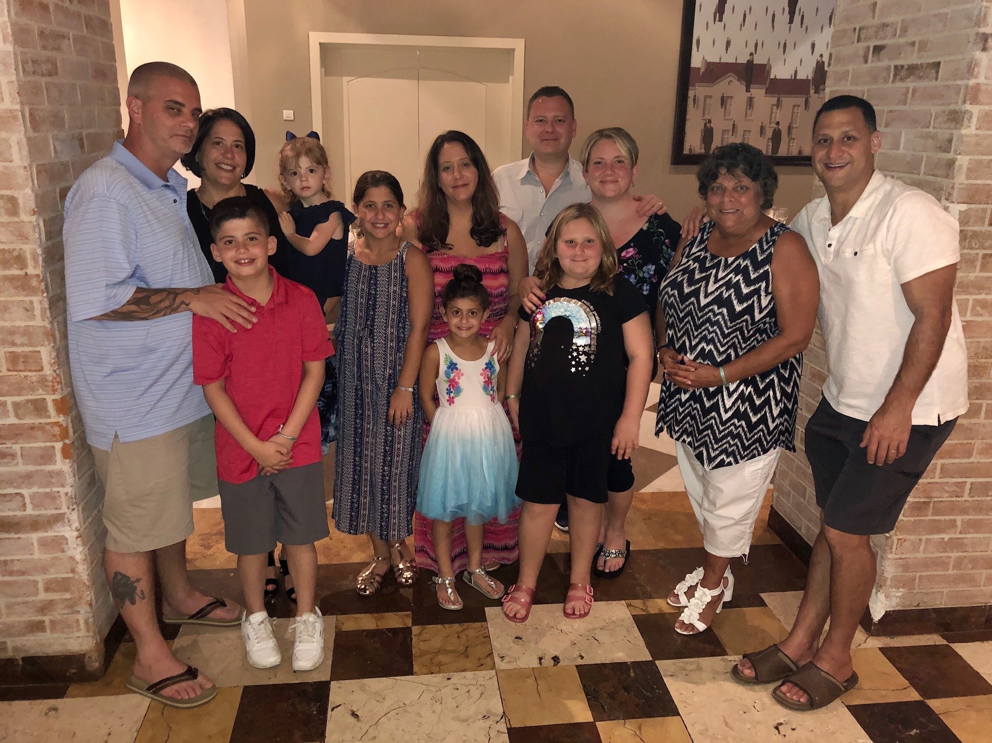 caption: This photo from a trip last November shows the friends and family members whom Danielle Zonis (third from right) has chosen to quarantine with during the coronavirus pandemic. She started a Facebook group for others to discuss the choices they're making to stay safe.