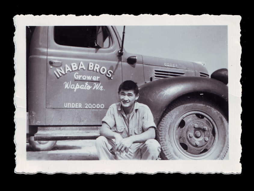 caption: Gilbert Inaba, Lon Inaba’s uncle, sitting by the Dodge truck the was given to the Inaba Family by good friend and seed merchant, Wilbur Logan, after they returned from the internment camps. “Pay me whenever you can. You need it much more than I do,” Lon Inaba recalls Logan saying. “He was a great friend of our family and the Japanese farmers in the valley,” Inaba says.
