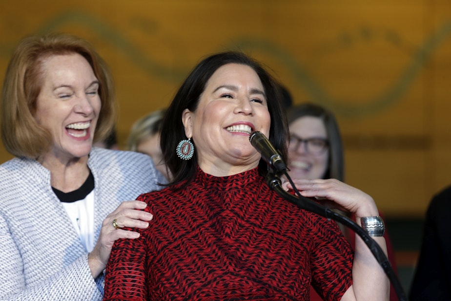 caption: Seattle Mayor Jenny Durkan, left, playfully interrupted Seattle City Councilmember Debora Juarez as Juarez spoke about the renovation of KeyArena, Wednesday, Dec. 6, 2017, in Seattle.